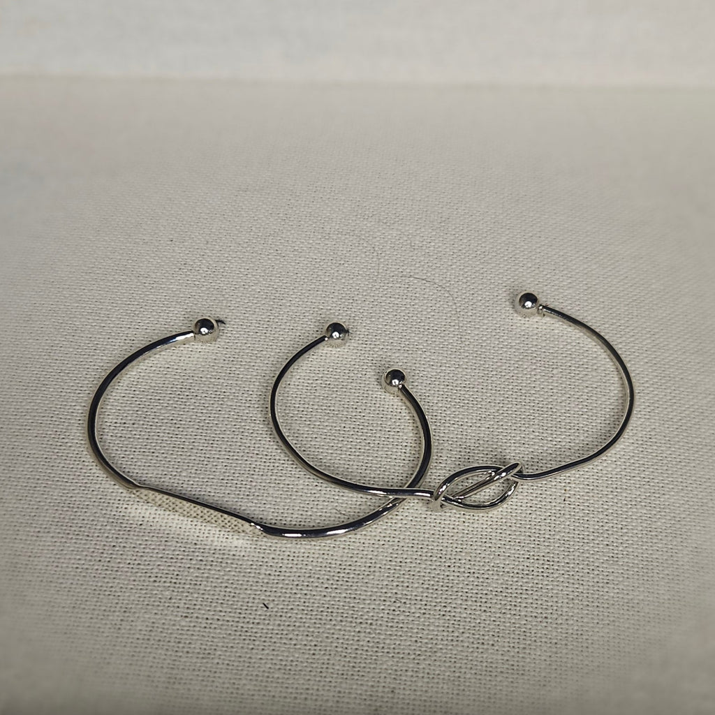 Pair of silver adjustable bangles