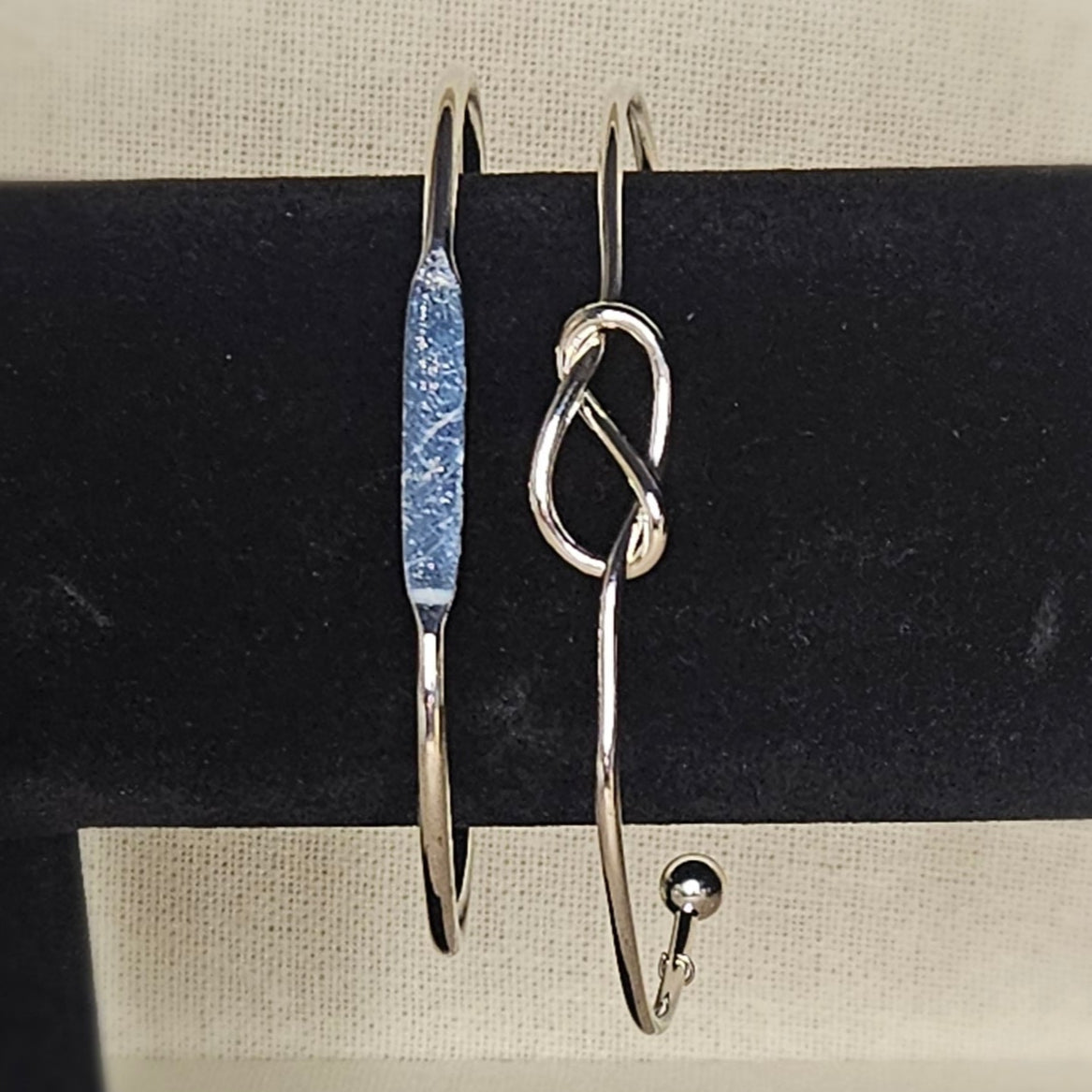 Pair of silver adjustable bangles